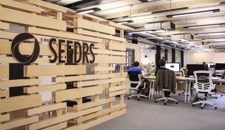 The Seedrs logo on a wooden screen at the London office